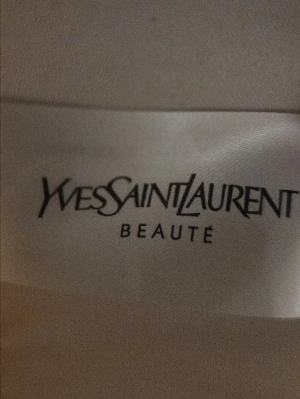 Yves Saint Laurent White Cosmetic Pouch with Gold Logo